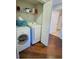 Convenient laundry room with washer, dryer, and storage shelves at 1300 Park West Blvd # 1109, Mount Pleasant, SC 29466