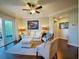 Spacious living room with hardwood floors, access to balcony, and comfortable seating at 1300 Park West Blvd # 1109, Mount Pleasant, SC 29466