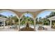 Inviting pool area with lounge chairs under a covered patio at 1300 Park West Blvd # 1109, Mount Pleasant, SC 29466
