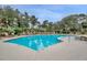 Curved swimming pool with plenty of lounge chairs at 1300 Park West Blvd # 1109, Mount Pleasant, SC 29466