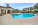 Community pool with surrounding lounge chairs and building in background at 1300 Park West Blvd # 1109, Mount Pleasant, SC 29466