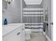 Modern bathroom with gray shiplap, white vanity, and updated fixtures at 1300 Park West Blvd # 417, Mount Pleasant, SC 29466