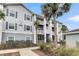 Gray apartment building with palm trees and landscaping at 1300 Park West Blvd # 417, Mount Pleasant, SC 29466