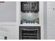 Built-in home bar with wine cooler and ample storage at 1300 Park West Blvd # 417, Mount Pleasant, SC 29466