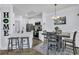Modern kitchen with stainless steel appliances and adjacent dining area at 1300 Park West Blvd # 417, Mount Pleasant, SC 29466