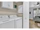 Convenient laundry room with side-by-side washer and dryer at 1300 Park West Blvd # 417, Mount Pleasant, SC 29466