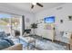 Living room with sliding door to balcony and coastal decor at 1300 Park West Blvd # 417, Mount Pleasant, SC 29466