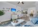 Bright living room with comfy seating, large TV, and open concept floor plan at 1300 Park West Blvd # 417, Mount Pleasant, SC 29466
