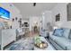 Open concept living room featuring a cozy seating area and kitchen views at 1300 Park West Blvd # 417, Mount Pleasant, SC 29466