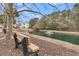 Serene pond with a fountain and park bench at 1300 Park West Blvd # 417, Mount Pleasant, SC 29466