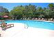 Sparkling community pool with plenty of seating at 1300 Park West Blvd # 417, Mount Pleasant, SC 29466