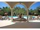 Scenic pool view from under a covered pavilion at 1300 Park West Blvd # 417, Mount Pleasant, SC 29466