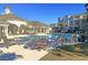 Community pool with tables and chairs for relaxation at 1300 Park West Blvd # 417, Mount Pleasant, SC 29466
