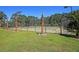 Well-maintained tennis courts with palm trees at 1300 Park West Blvd # 417, Mount Pleasant, SC 29466