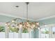 Ornate chandelier in a bright dining room at 141 Low Tide Ct, Charleston, SC 29492