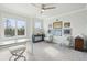 Bright home office features built-in workspace, two armchairs, and inspiring wall art at 141 Low Tide Ct, Charleston, SC 29492