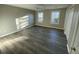 Large bedroom with wood-look flooring and ample natural light at 148 Ponderosa Dr, Ladson, SC 29456