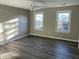 Well-lit bedroom featuring two windows and vinyl flooring at 148 Ponderosa Dr, Ladson, SC 29456