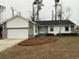 House exterior with a two-car garage and landscaping at 148 Ponderosa Dr, Ladson, SC 29456