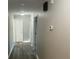 Clean hallway with light grey walls and wood-look flooring at 148 Ponderosa Dr, Ladson, SC 29456