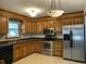 Bright kitchen with stainless steel appliances and wood cabinets at 148 Ponderosa Dr, Ladson, SC 29456