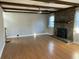 Spacious living room featuring hardwood floors and a brick fireplace at 148 Ponderosa Dr, Ladson, SC 29456