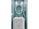 Small bathroom with white vanity and round mirror at 151 Belleplaine Dr, Goose Creek, SC 29445