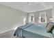 Bright bedroom featuring a large bed and two windows at 151 Belleplaine Dr, Goose Creek, SC 29445
