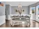 Bright dining room featuring hardwood floors and a farmhouse table at 151 Belleplaine Dr, Goose Creek, SC 29445