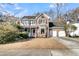 Two story brick home with attached garage and mature trees at 151 Belleplaine Dr, Goose Creek, SC 29445