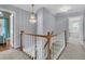Spacious upper hallway with carpet and chandelier at 151 Belleplaine Dr, Goose Creek, SC 29445