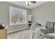 Home office with a glass desk and large window at 151 Belleplaine Dr, Goose Creek, SC 29445