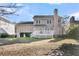 Two story house with beige siding, deck, and backyard at 151 Belleplaine Dr, Goose Creek, SC 29445