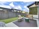 Landscaped backyard with artificial turf and seating at 157 Pocket Bend Cir # B, Summerville, SC 29486