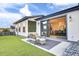 Relaxing backyard patio with artificial turf, seating area, and sliding glass doors leading to the interior at 157 Pocket Bend Cir # B, Summerville, SC 29486