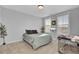 Bright bedroom with neutral decor and a pet crate at 157 Pocket Bend Cir # B, Summerville, SC 29486