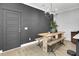 Farmhouse dining table with bench seating and a dark accent wall at 157 Pocket Bend Cir # B, Summerville, SC 29486