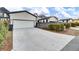White garage door with concrete driveway and landscaping at 157 Pocket Bend Cir # B, Summerville, SC 29486