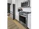 Stainless steel appliances in a kitchen with white cabinets and wood flooring at 157 Pocket Bend Cir # B, Summerville, SC 29486