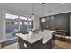 Kitchen with farmhouse sink, island, and sliding glass doors to backyard at 157 Pocket Bend Cir # B, Summerville, SC 29486