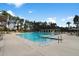 Relaxing pool area with ample lounge chairs and umbrellas at 157 Pocket Bend Cir # B, Summerville, SC 29486