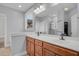 Double vanity bathroom with a large mirror and shower at 1724 Bee Balm Rd, Johns Island, SC 29455