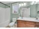 Bathroom boasts a double vanity, tub, and a window at 1724 Bee Balm Rd, Johns Island, SC 29455