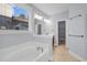 Clean bathroom with tiled floors and a bathtub at 1724 Bee Balm Rd, Johns Island, SC 29455