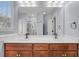 Double vanity bathroom with a large mirror and shower at 1724 Bee Balm Rd, Johns Island, SC 29455
