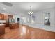 Open concept dining room with hardwood floors, adjacent to kitchen at 1724 Bee Balm Rd, Johns Island, SC 29455