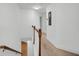 Upper hallway with carpeted floor and wooden railing at 1724 Bee Balm Rd, Johns Island, SC 29455