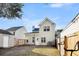 Tan house exterior with a fenced backyard at 1724 Bee Balm Rd, Johns Island, SC 29455