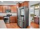 Kitchen features stainless steel appliances and wood cabinetry at 1724 Bee Balm Rd, Johns Island, SC 29455