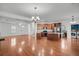 Open concept kitchen with island, stainless steel appliances, and hardwood floors at 1724 Bee Balm Rd, Johns Island, SC 29455